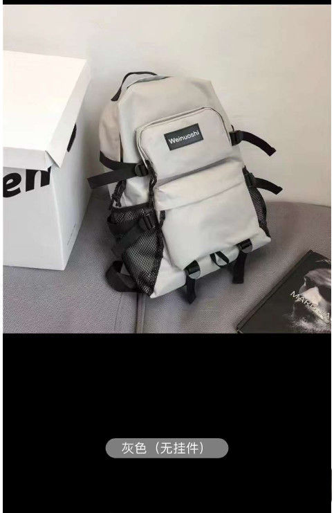Logo personnalisé Sac à dos étudiant Homme et femme Étudiants de grande capacité Mode tendance Sac à dos simple Sac à dos féminin