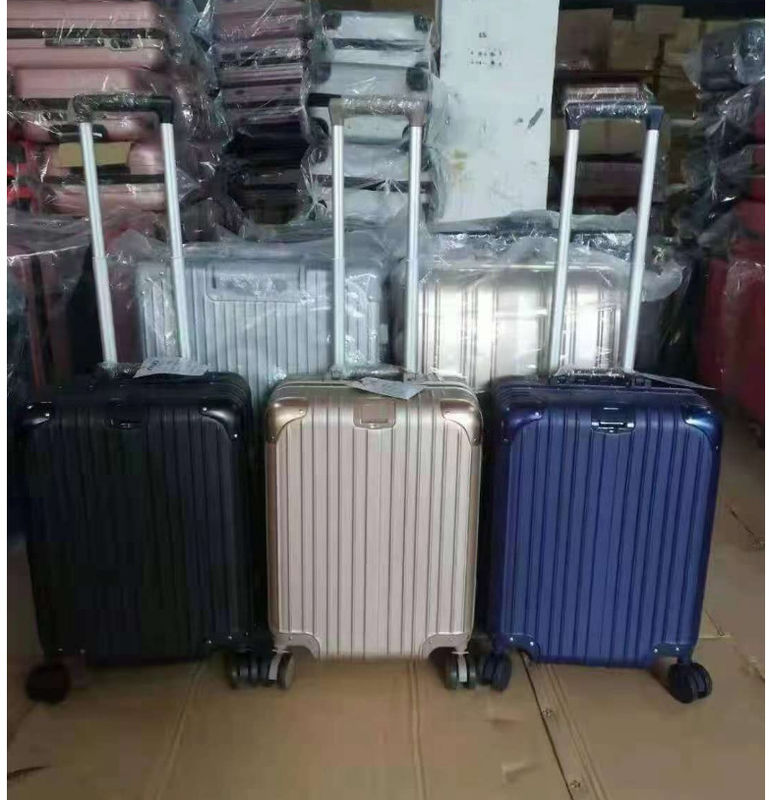 Nouvelle dernière valise de voyage ABS+PC Universal roue fermeture à glissière chariot boîte de traction en cuir boîte code boîte bagages en gros