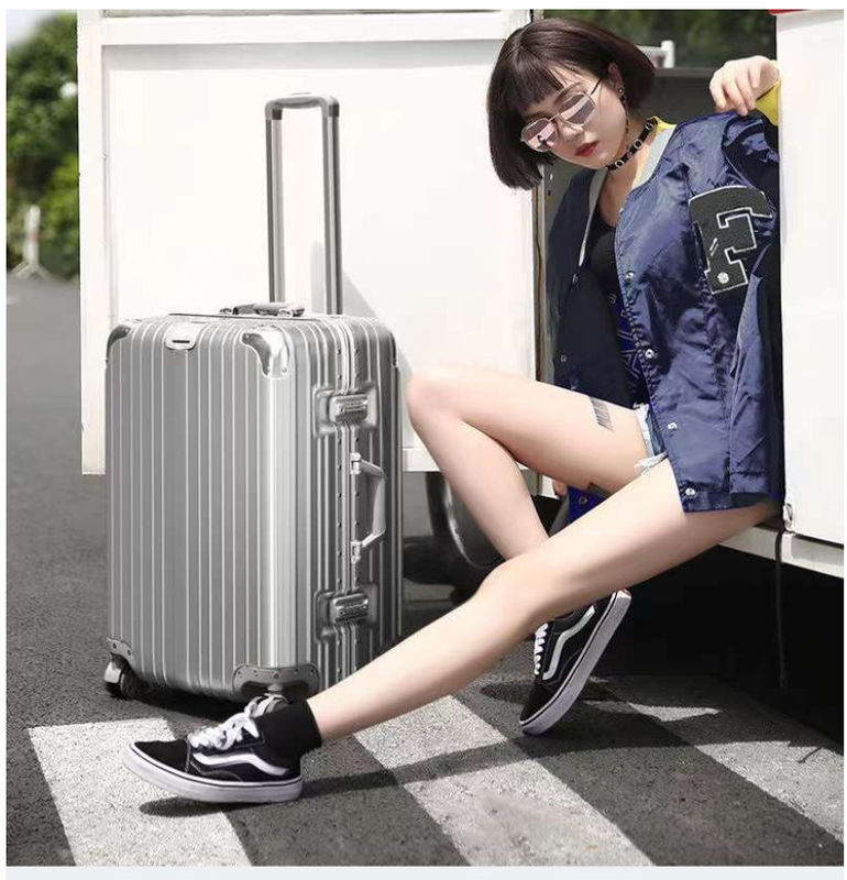Nouvelle dernière valise de voyage ABS+PC Universal roue fermeture à glissière chariot boîte de traction en cuir boîte code boîte bagages en gros
