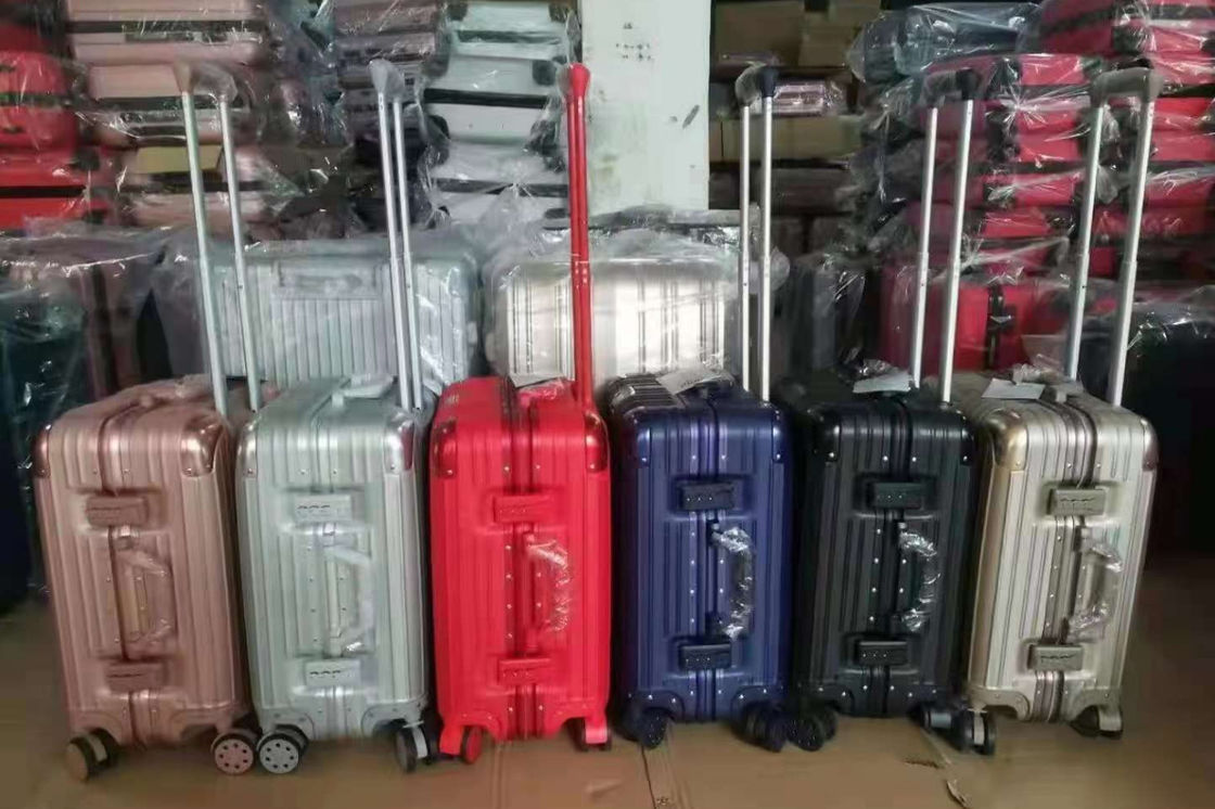 Nouvelle dernière valise de voyage ABS+PC Universal roue fermeture à glissière chariot boîte de traction en cuir boîte code boîte bagages en gros